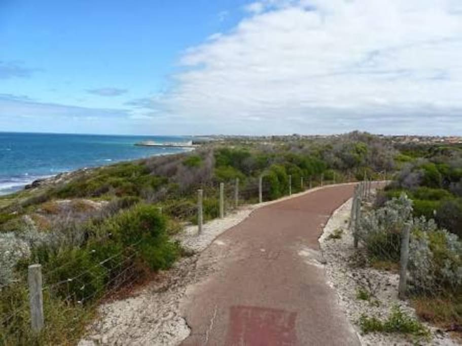 A scenic cycle/walking track follows the coast.