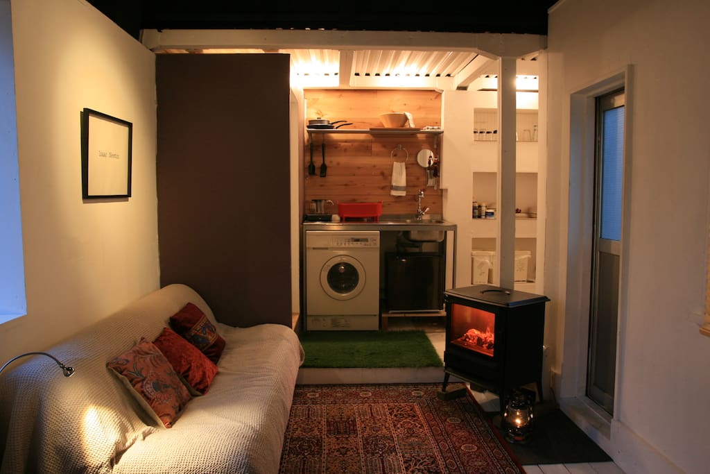 Room at night with electric wood stove