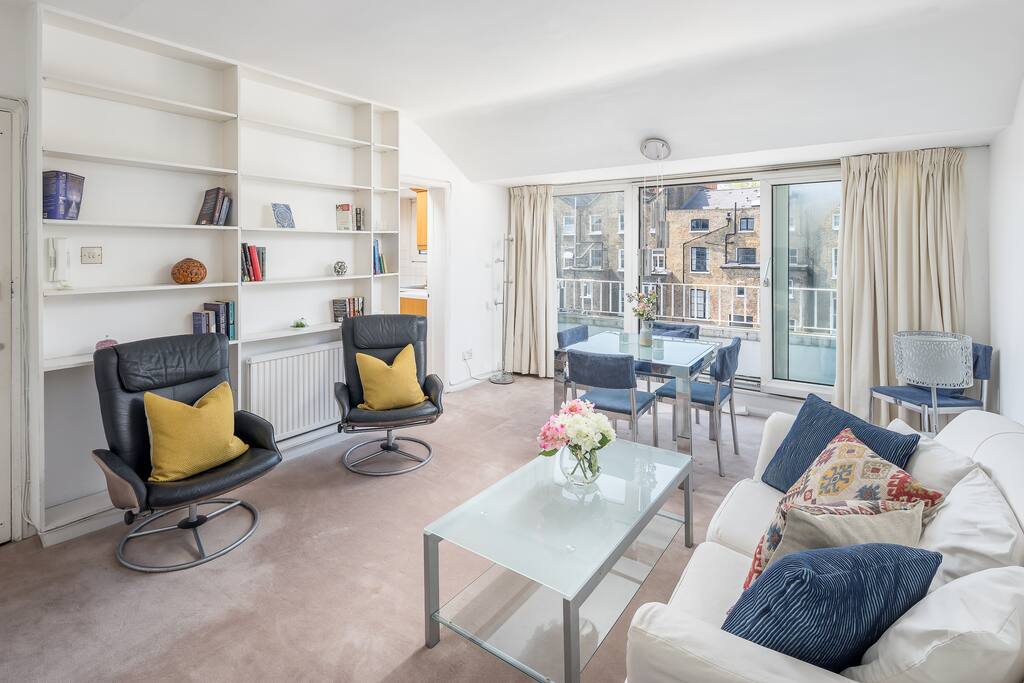 Big glass doors fill the room with natural light.
