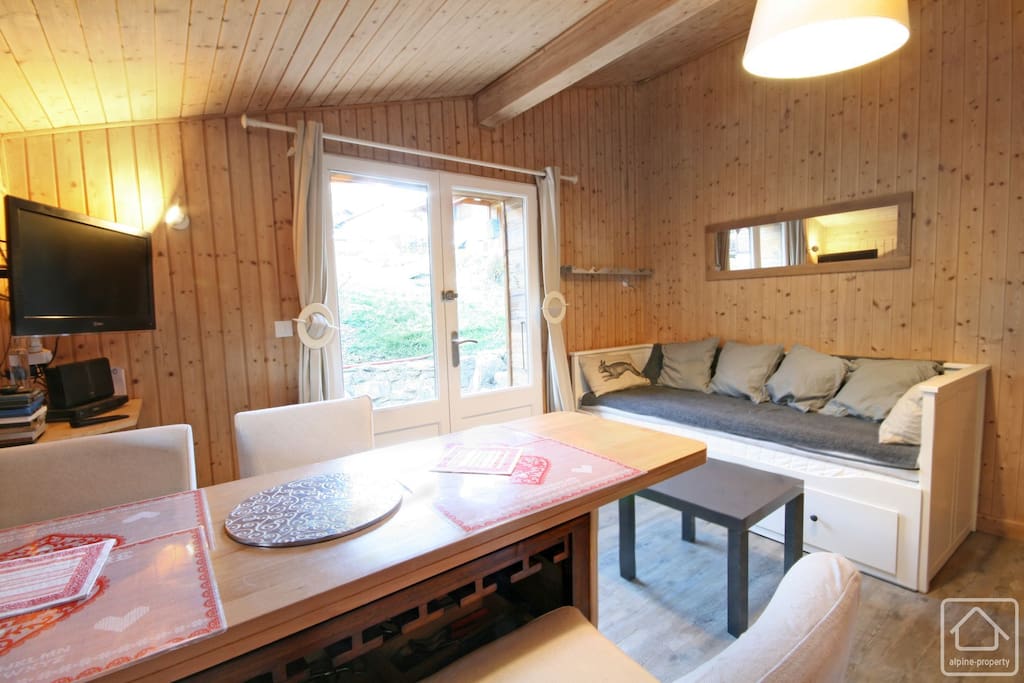 Main door entrance, seating area and television