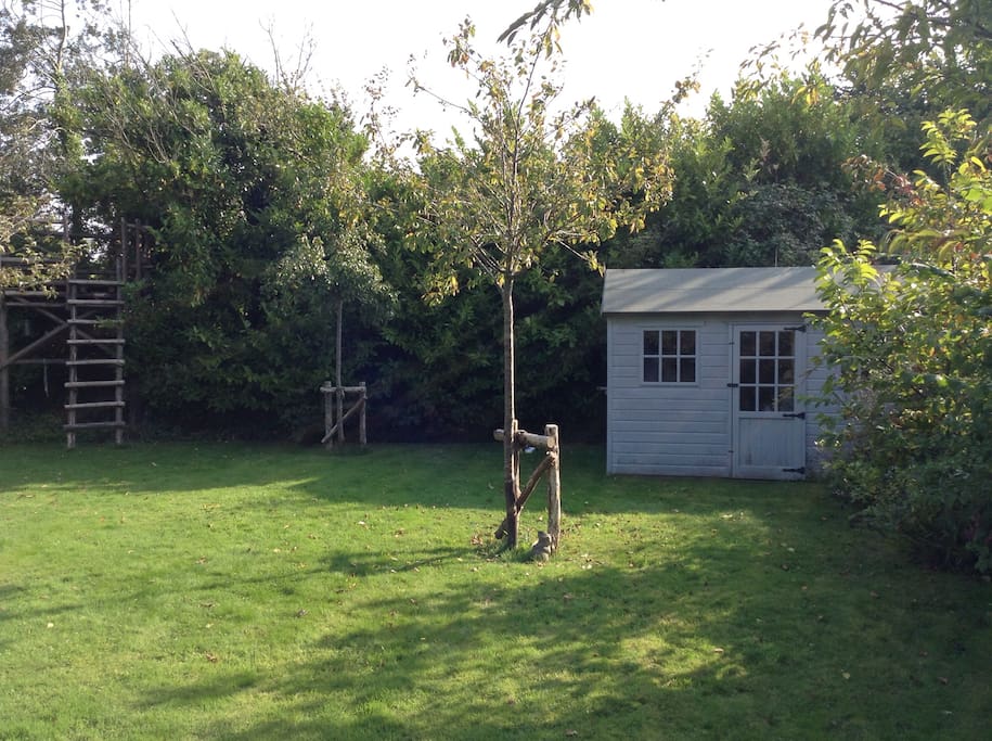 Pretty garden with treehouse