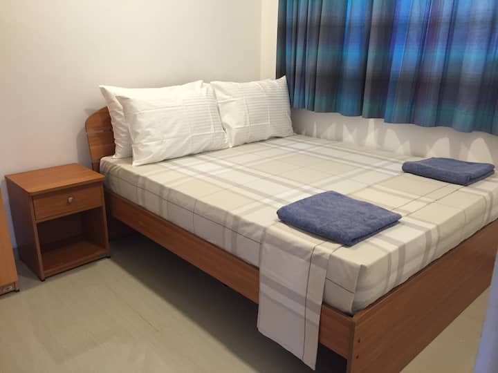Comfortable bedroom with a large bed and relaxing atmosphere.