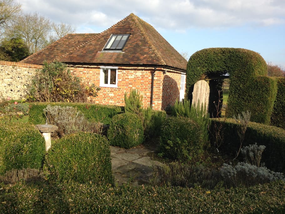 Podlinge Barn taken from cottage garden