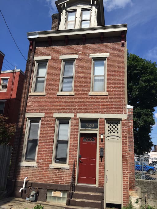 This is the front of the house! The house number is over the door. You'll type your code into the lock and then you'll be in the living room.