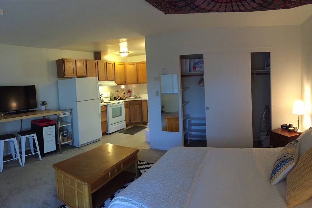 A wide open studio apartment with the whole space connected
