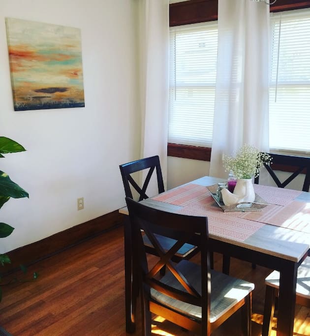 Sunroom/dining room with plenty of natural light to wake you up while you are enjoying your coffee in the morning.