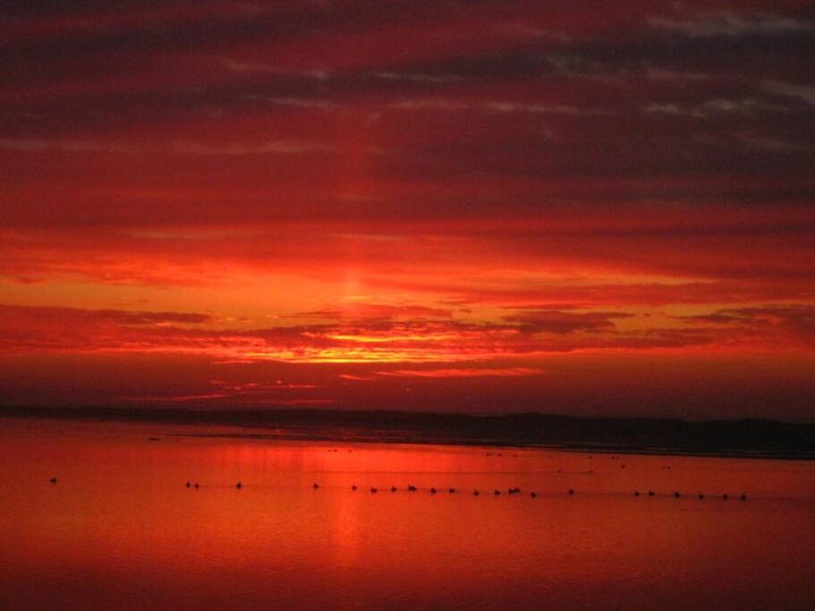 Sunrise from deck looking over water