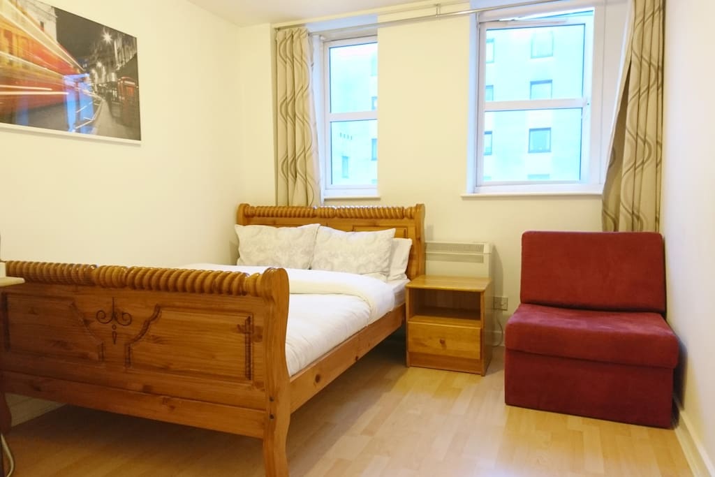 Main Bedroom Includes a Queen Bed with a Single sofa. Sofa converts into a bed