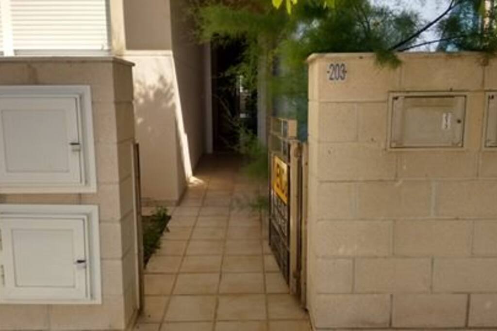 entrance with parking space in front of apartment