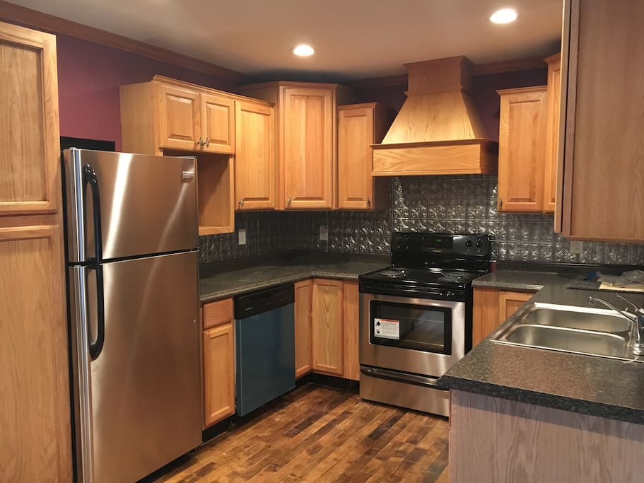 This is the kitchen with brand new, stainless steel appliances available for your culinary expertise.