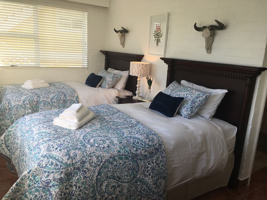 Second bedroom with two single beds.