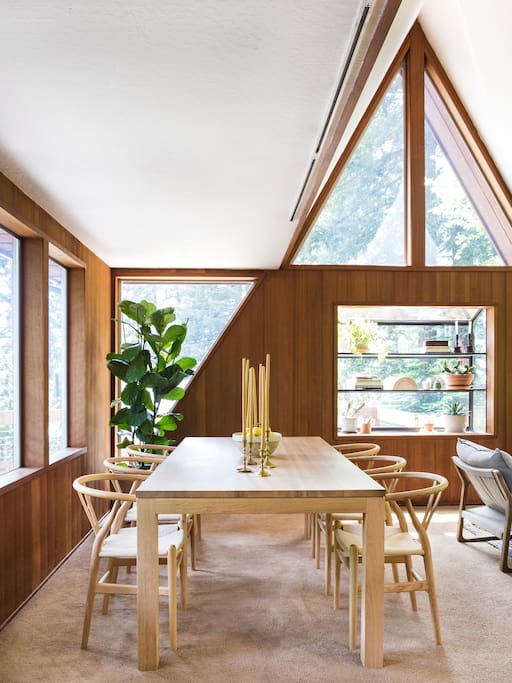 The dining area overlooks redwood trees.