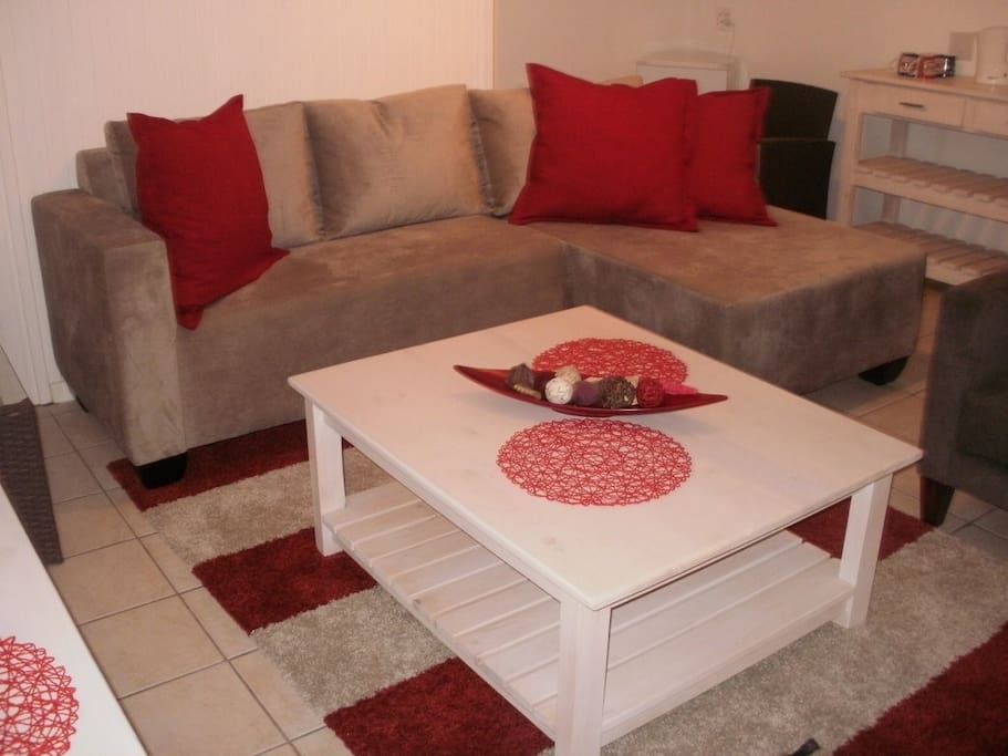 Second lounge situated downstairs with two bedrooms leading onto covered terrace overlooking the dam