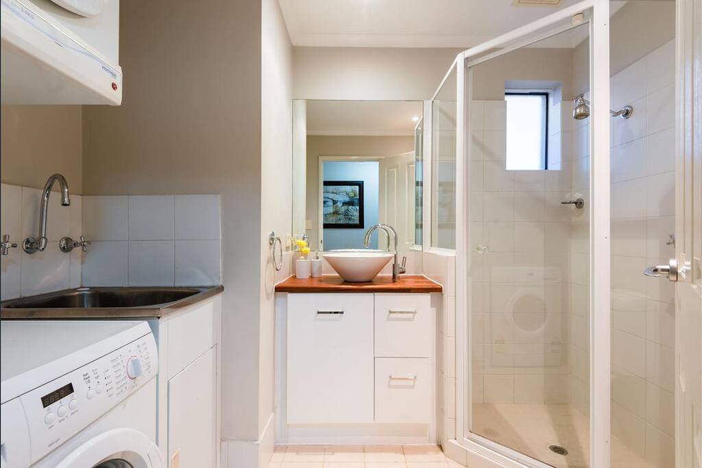 Shower, toilet, 2 sinks, washer, dryer.