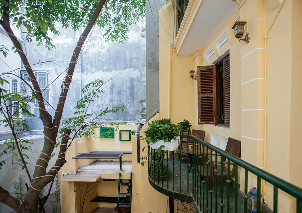 A private balcony just for your stay with a pair of chair and a table.
