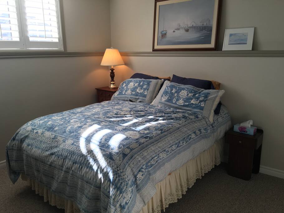 Suite bedroom, new queen bed, dresser, desk and chair.
