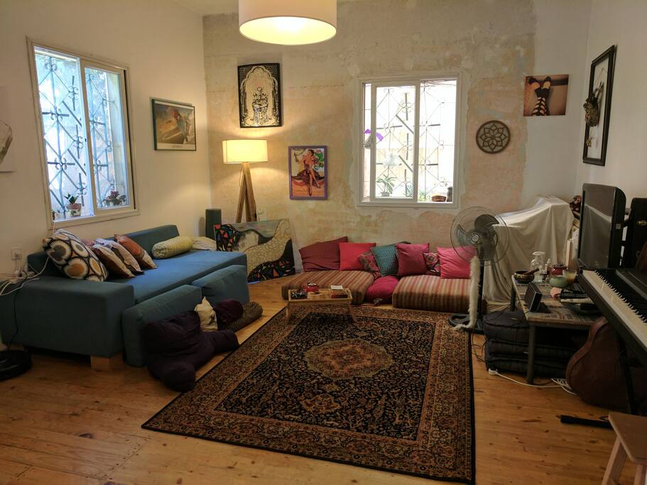 living room (right hand side there is a piano and also treatment tables and shiatsu mat under the white sheet)