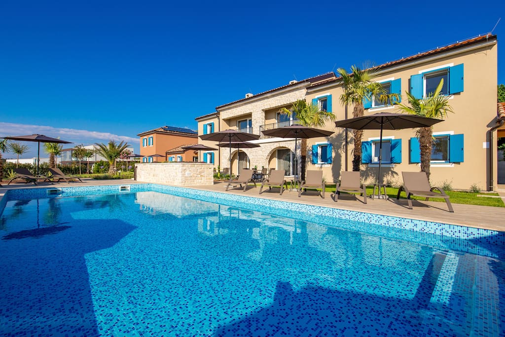 Olea Residence - exterior with sun deck and pool