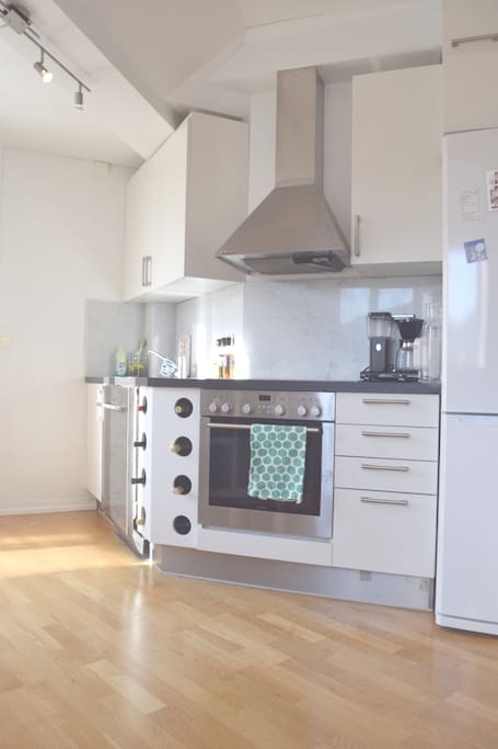 Fully equipped kitchen, including coffee maker and dishwasher.