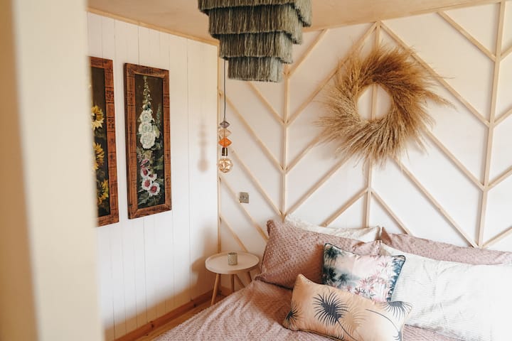 master bedroom with a super king size bed. 
