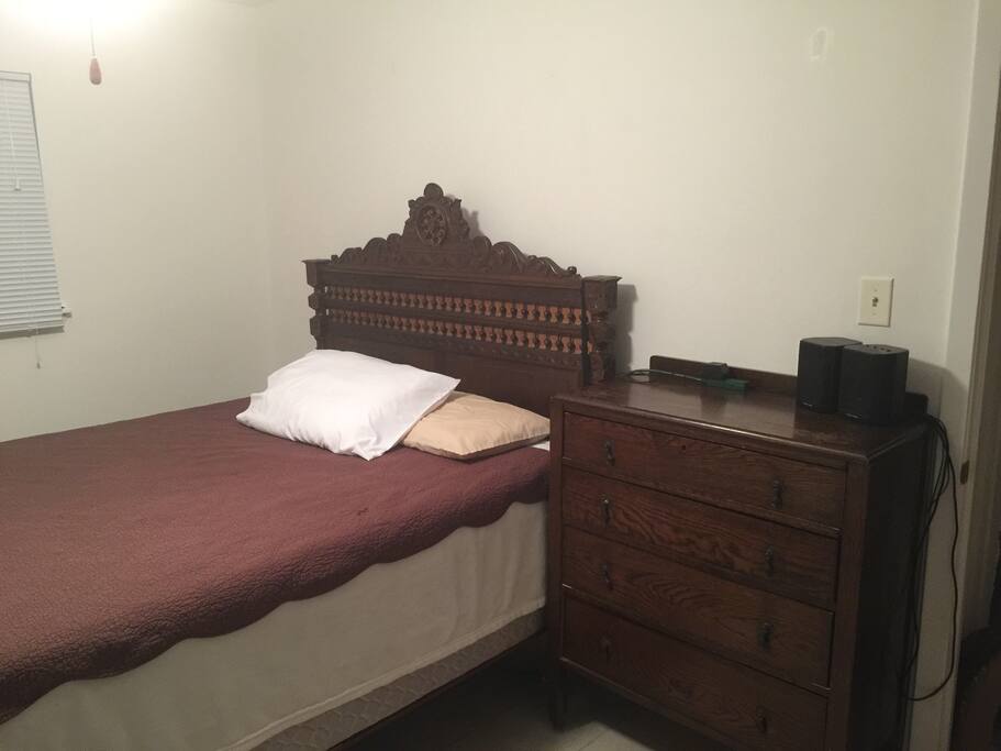 Dresser Drawers and power strips on either side of the bed.