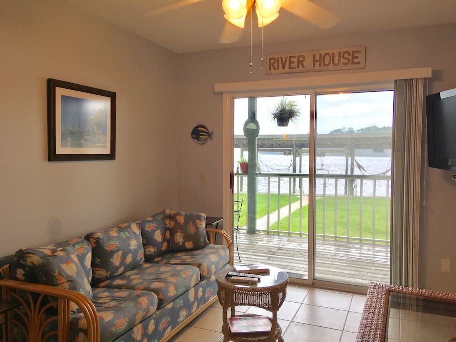 Fold-out couch, covered porch with dinning sets, ceiling fans and grill!