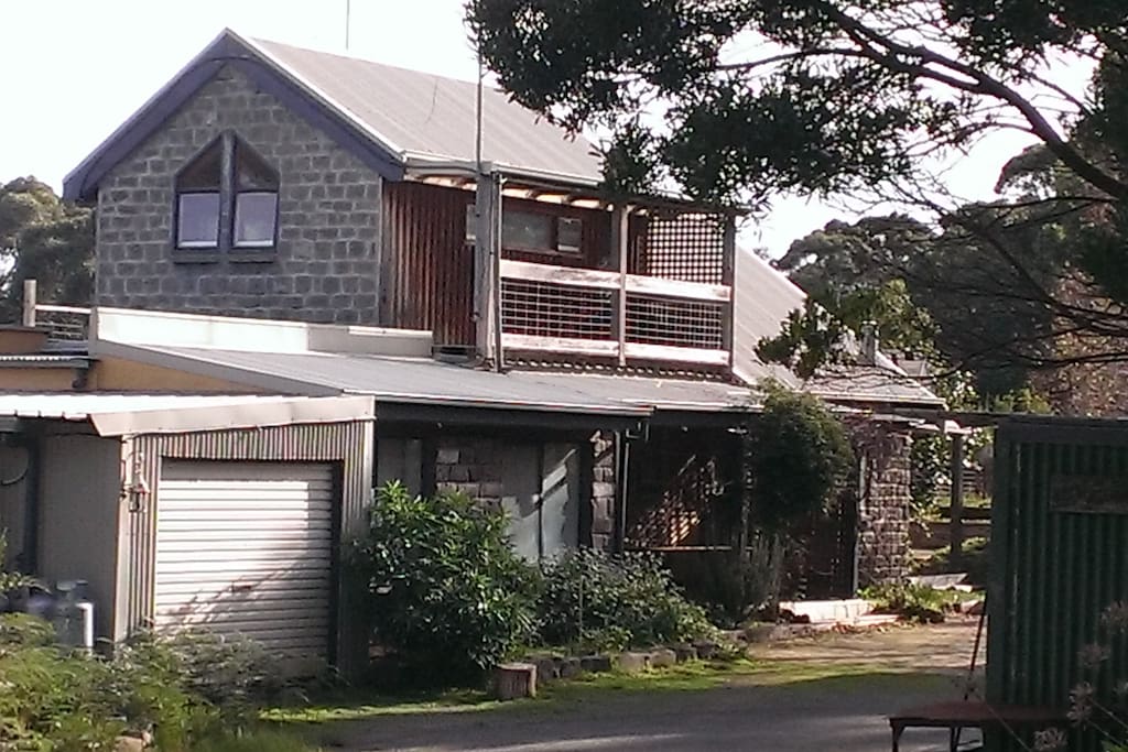 The apartment is downstairs and fully self-contained. The bedrooms catch the morning sun, and the living room has stunning views across Johanna Beach to Moonlight Head.