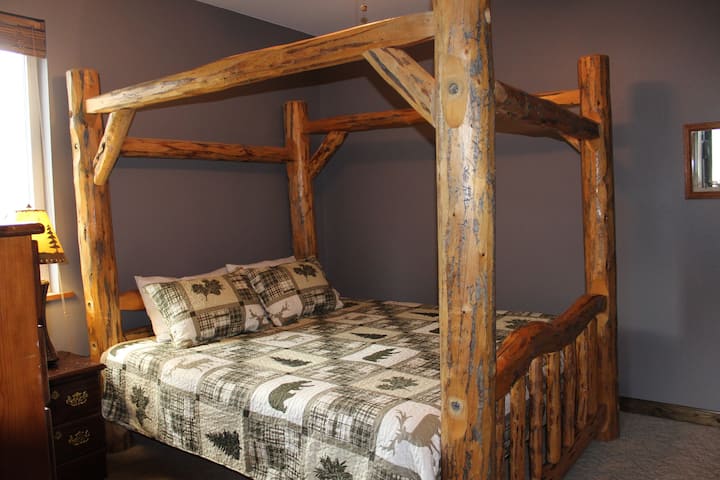 King size log canopy bed