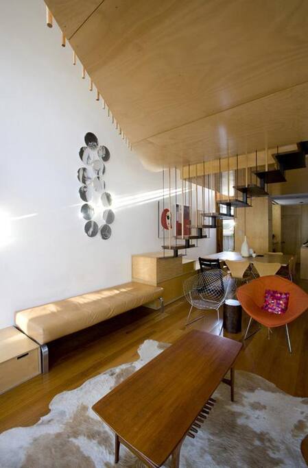 This is looking across the lounge/dining/
kitchen space with the stairs up to the loft main bedroom