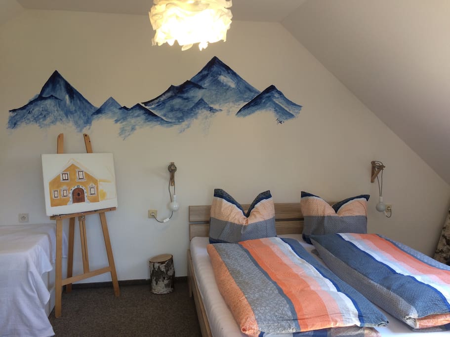 Beedroom with moutain paint