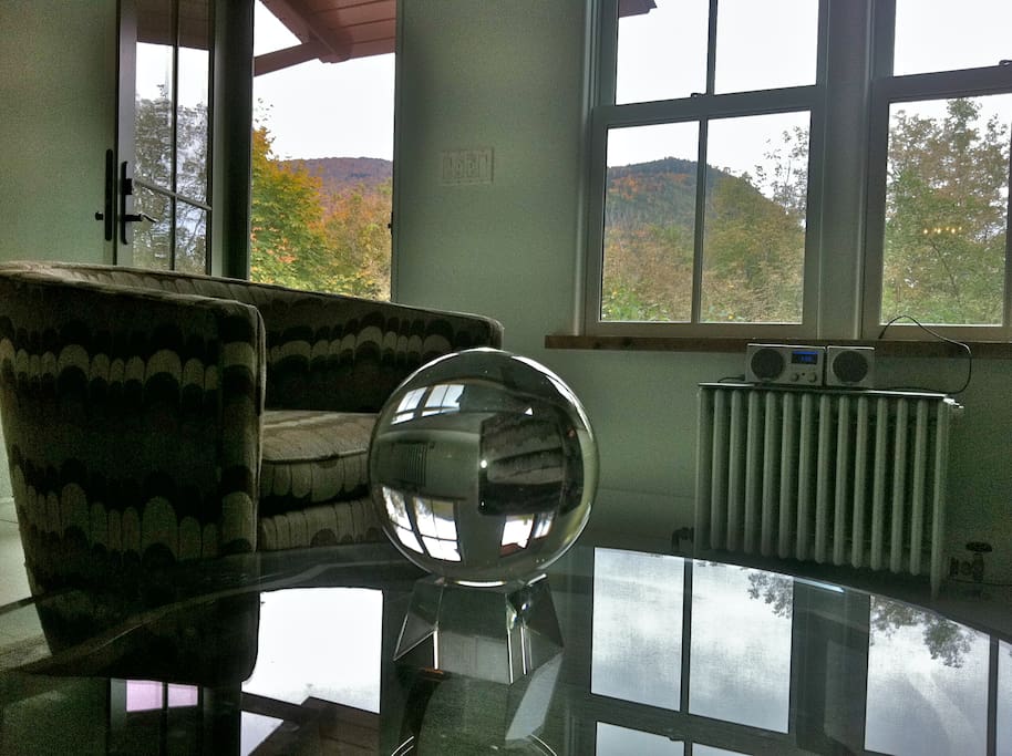Detail of living area, with crystal ball, vintage chairs, great view and south light.