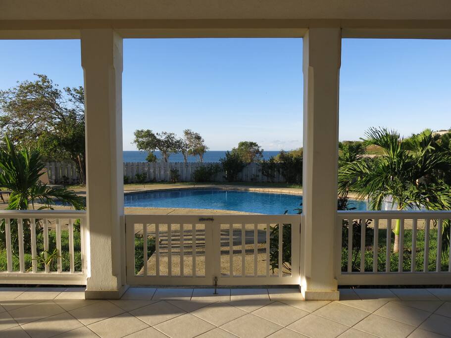 View of pool and ocean from back verandah