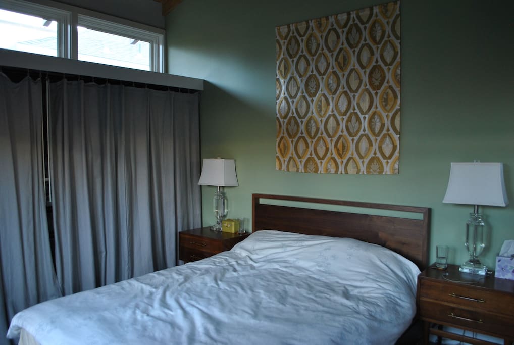 Master bedroom featuring queen bed and private bathroom