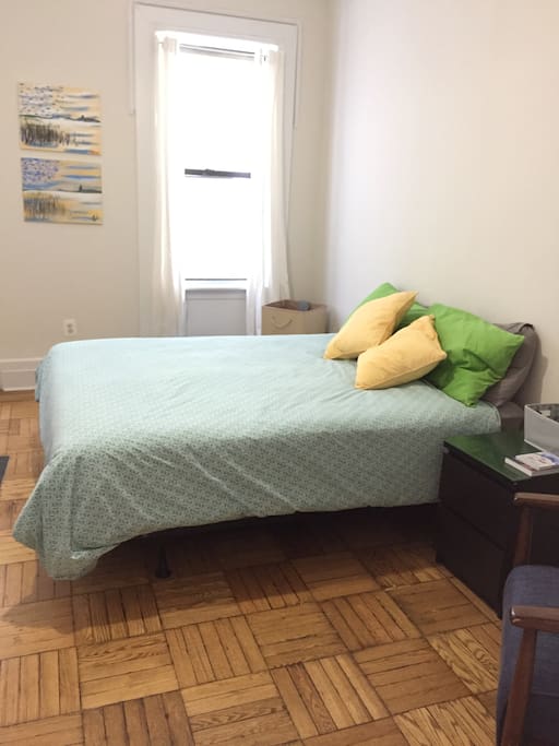 Your bedroom with double windows and great light, closet and full length mirror, dresser and reading nook with chair and table.