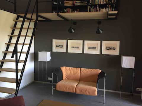 Village studio with loft, terrace and view of the mill