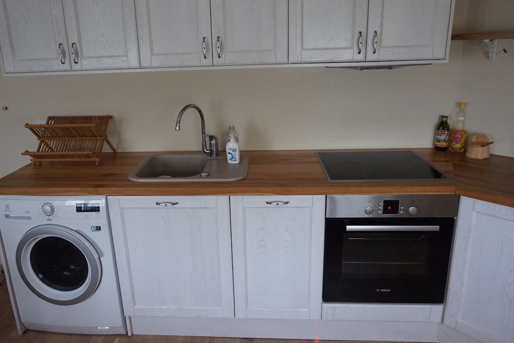 Washing machine with dryer, dishwasher, oven, microwave, fridge and stove.