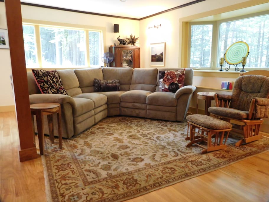 Living room -open concept. Both ends of sofa seating recline.
