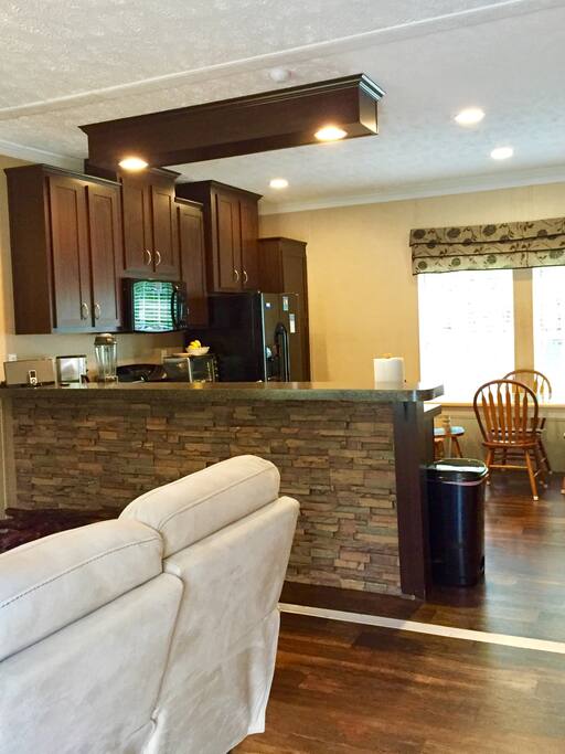 View of kitchen from front entrance.