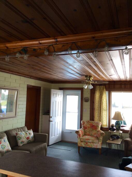 The living room has plenty of seating. The sofa has a pull out bed providing additional sleeping area.