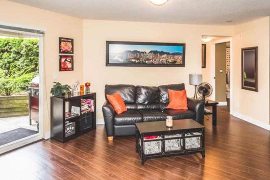 Comfy couch across from.fire place and 60" HDTV