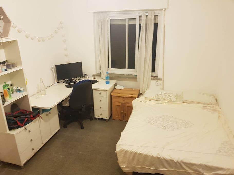 the bedroom is spacious and has the cool breeze in the morning