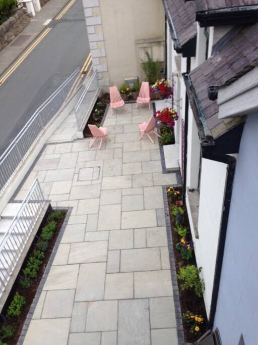 Bird's eye view of the front patio. Lovely space for sitting out and enjoying the quiet village atmosphere.