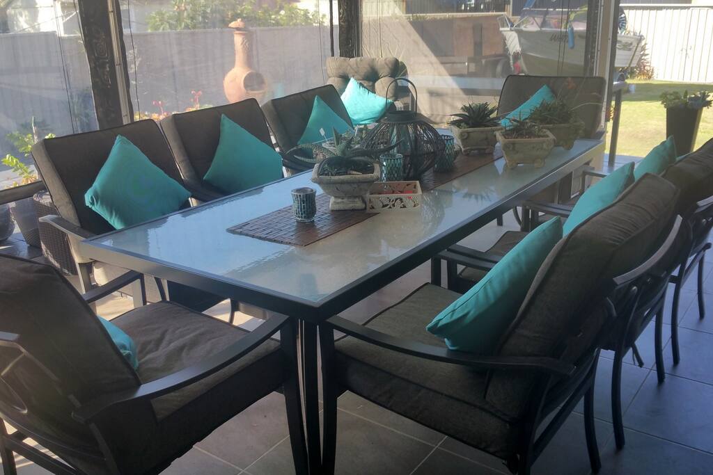 Comfortable out door living by the BBQ and pool.