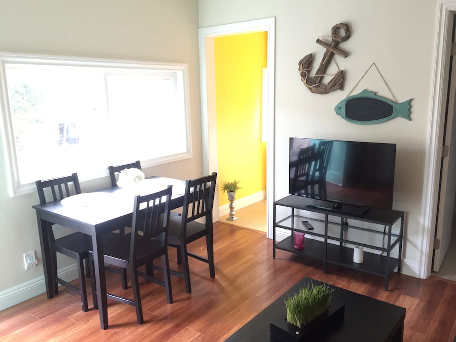 Living room with dining table and TV