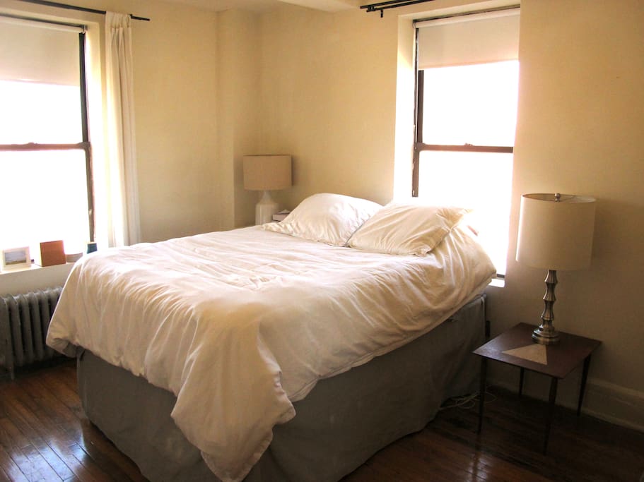 Spacious bedroom with queen size bed. Curtains block out morning sun completely.