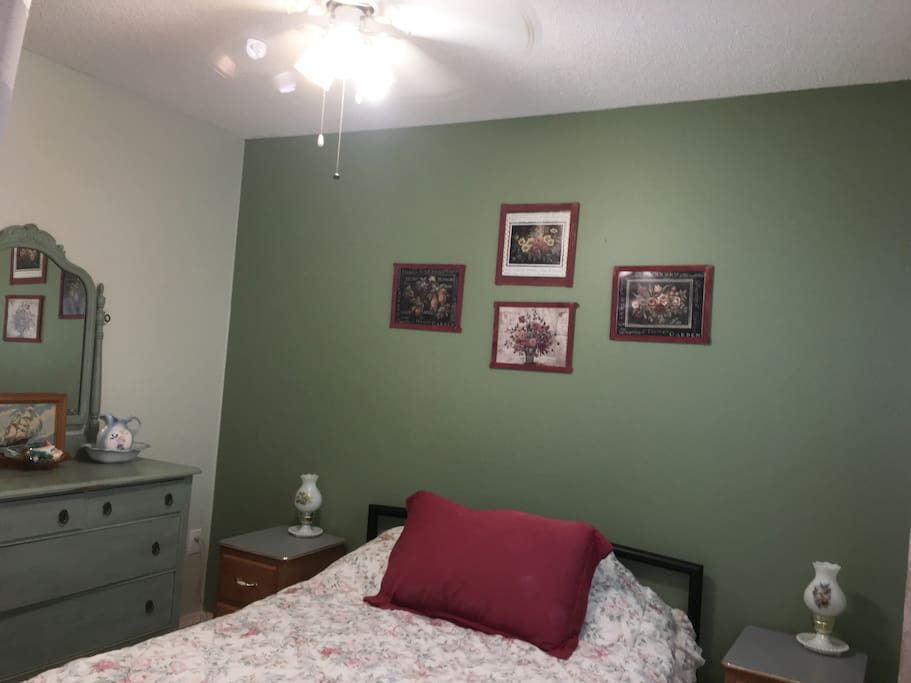 bedroom with double bed, dresser and closet