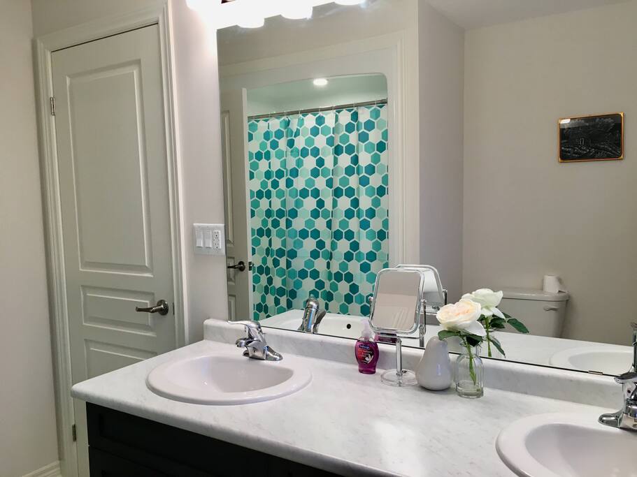 attached washroom with spacious counter space and double sinks
