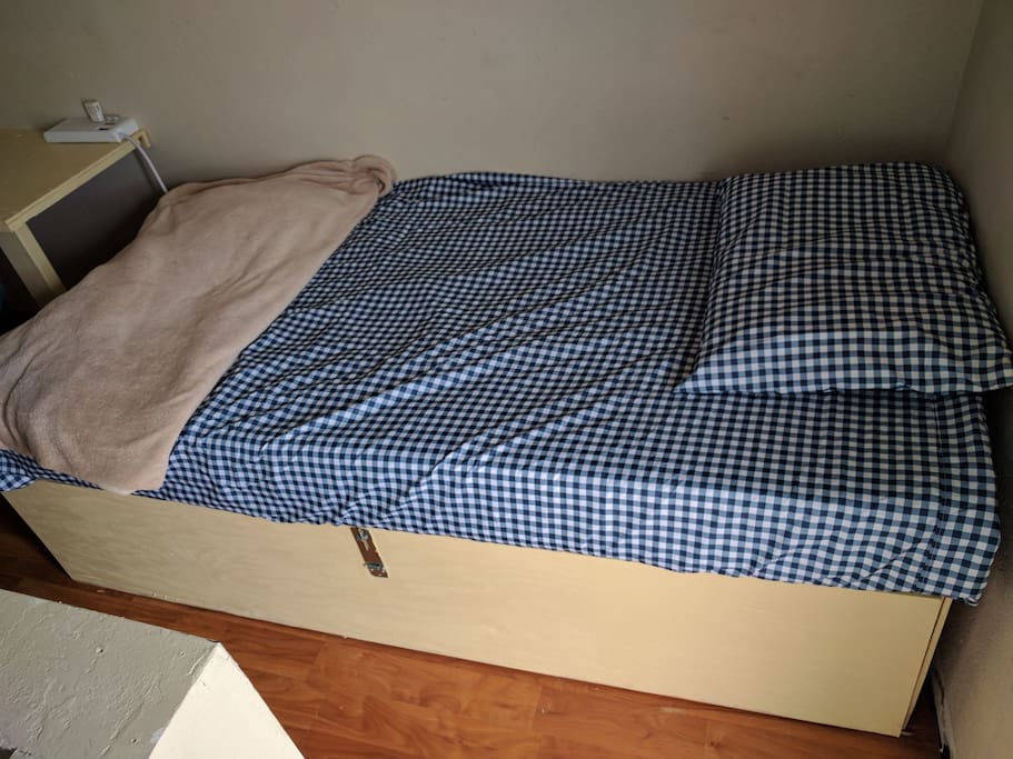 a simple but very comfortable twin pod with storage below and a desk