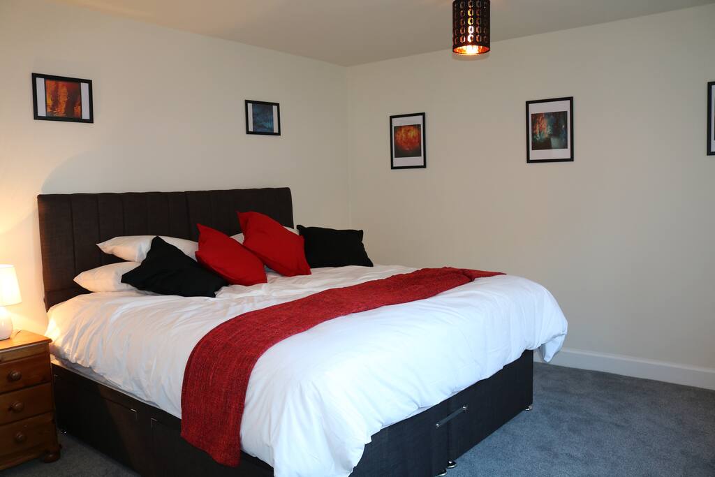 Comfortable (pocket-sprung) 6ft wide bed or two single beds, wardrobe, dressing table with drawers, chair, suitcase stand.