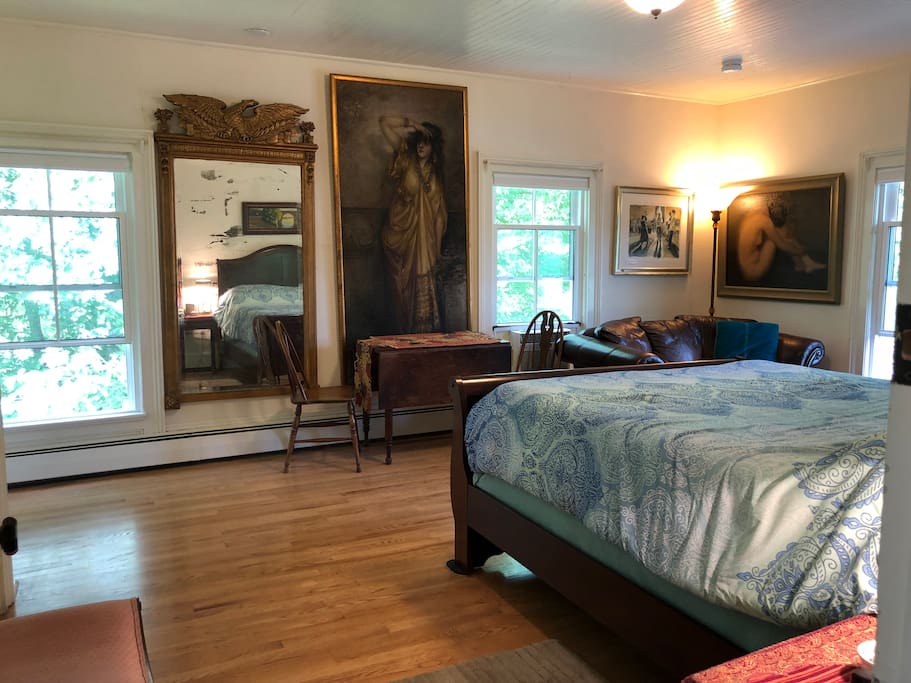 Bedroom suite with private bath, Q size bed with great mattress and boxspring, tv, comfortable sofa, hassock, table and chairs, desk.